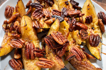 sliced acorn squash with pecans