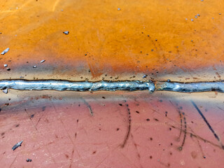Welding seams. Manufacturing works for welding steel elements. Welding seam close-up.