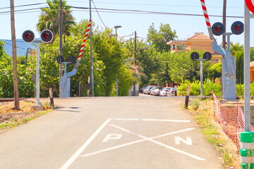 Naklejka premium Traffic light indicating level crossing to warn of the passing of trains