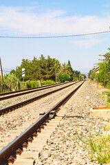 metal rails for the train to run on a sunny day