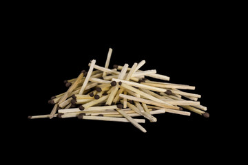 a stack of scattered Match sticks isolated black background