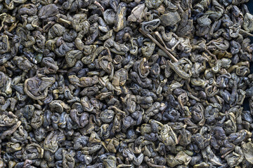 Green tea leaves background. Oolong tea. Abstract food textures. Close up .The high end tea of China.