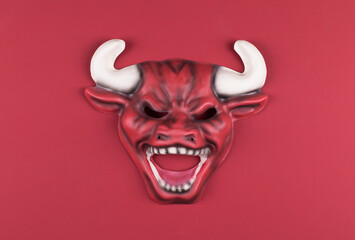 red bull mask on red background