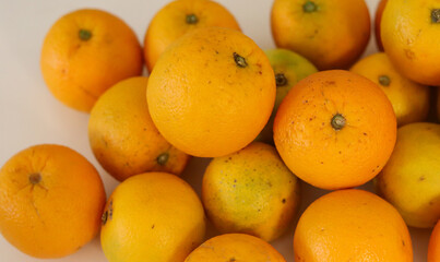 Beautiful oranges arranged on a table. A fruit rich in vitamin c.