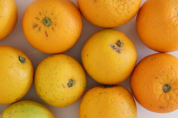 Beautiful oranges arranged on a table. A fruit rich in vitamin c.
