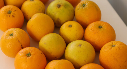 Beautiful oranges arranged on a table. A fruit rich in vitamin c.