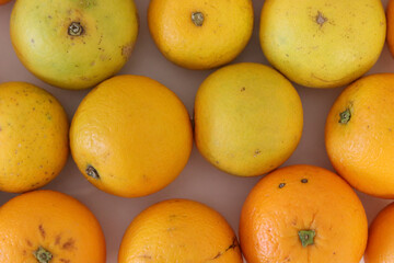 Beautiful oranges arranged on a table. A fruit rich in vitamin c.