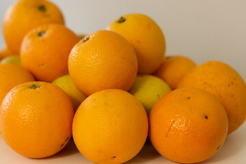 Beautiful oranges arranged on a table. A fruit rich in vitamin c.