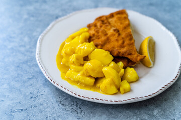 Potato Salad with Mustard, Turmeric and Curry Sauce. Served with Schnitzel.