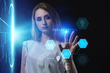 Business, Technology, Internet and network concept. Young businessman working on a virtual screen of the future and sees the inscription: Remarketing