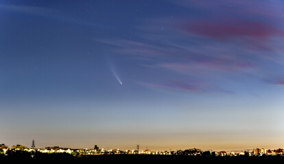Neowise comet over the city lights