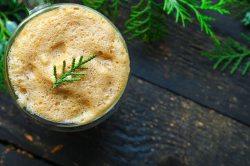 cup of coffee and spruce on the table, new year mood serving size. food background top view copy space 