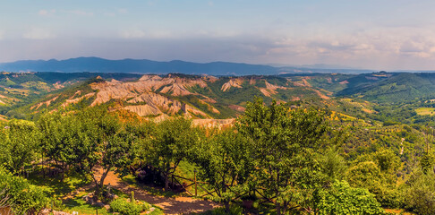 A panorama view over the surrounding countryside from the settlement of Civita di Bagnoregio in Lazio, Italy in summer