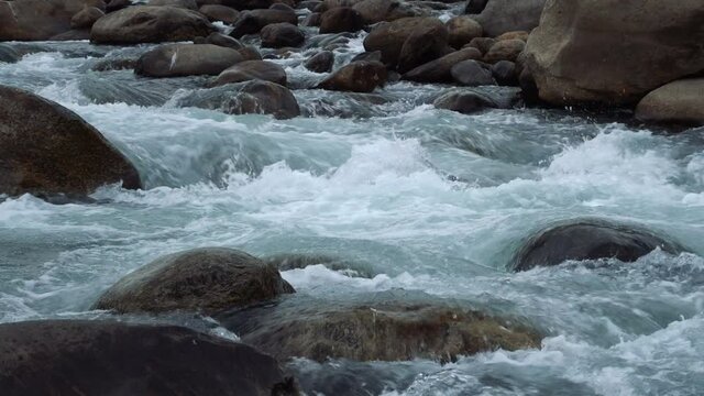 Water flowing on river bed of Joldhaka river, river stcok footage shot at Jhalong, a place of Dooars , north of West Bengal, India.