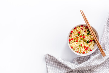 with pepper,peas, chopstick and greens. White background top view copy space