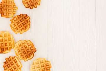 belgian waffles on wooden background top view mockup