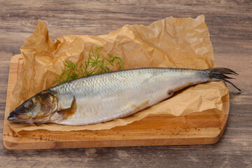 Salted herring over the wooden board
