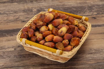 Sweet tasty dry dates in the basket