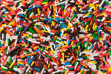 Fototapeta na wymiar Sugar sprinkle dots, decoration for cake and bekery, a lot of sprinkles as a background