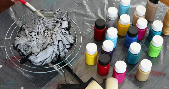 The process of painting in the style of tie dye