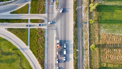 Aerial view of roundabout road. The transportation, traffic and byroad can be seen.   