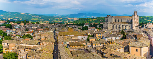 Naklejka premium The panorama view across the roof tops and cathedral in Orvieto, Italy in summer