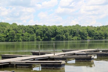 Fototapeta na wymiar The empty wood docks at the lake on a sunny day.