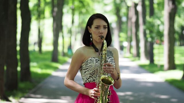 Girl playing at the saxophone
