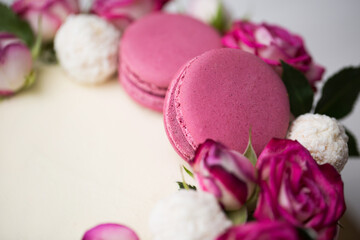 Cake with roses and macaroons