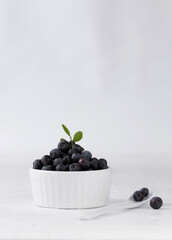 Blueberries in a white cup