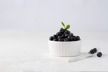 Blueberries in a white cup