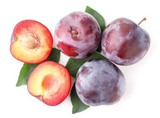 Ripe plums with leaves on a white. Top view