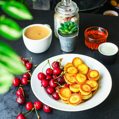 Mini pancakes cereal sweet breakfast snack dessert Menu serving. food background top view copy space