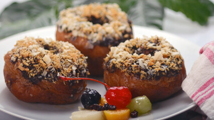 Close-up, Yummy Chocolate Donuts on a whitel plate with Various Topping