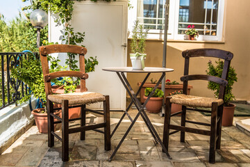 Typical kafenion set, table and traditional greek chairs.