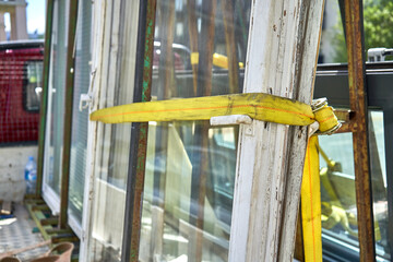Old wooden windows on a truck ready to be moved to recycle facility 