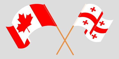 Crossed and waving flags of Georgia and Canada