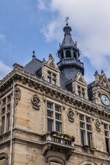 Obraz premium Architectural fragments of Vincennes Hotel de Ville (1887 - 1891) or Town hall of Vincennes. Vincennes - a commune in the Val-de-Marne department in the eastern suburbs of Paris, France.
