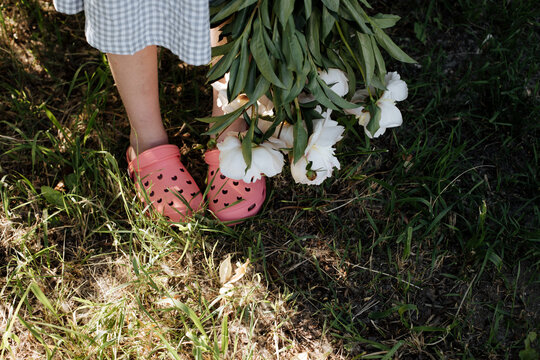 A bouquet of peonies is kept upside down