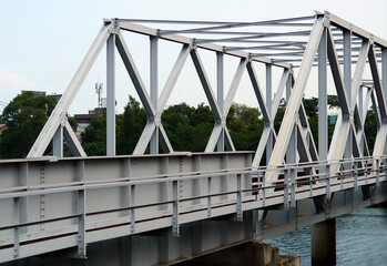 Modern, Steel, lattice structure of the Railway bridge over the Kalani river in Sri Lanka. View along the tracks.