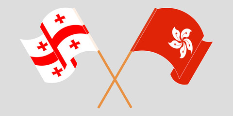 Crossed and waving flags of Georgia and Hong Kong