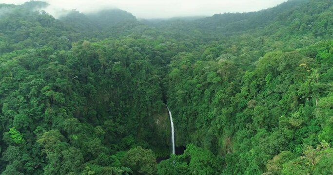 Costa Rica La Fortuna Waterfall in amazing rainforest nature landscape. Aerial drone video.
