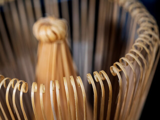 Macro close up of a chasen matcha whisk