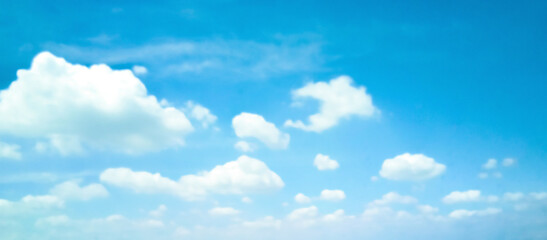 Beautiful blue sky and white clouds of various shapes with sunlight. Nature background