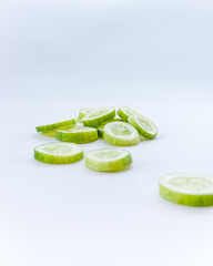 slices of fresh green cucumber. isolated white background. copyspace