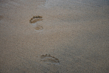 human footprints on the sea sand