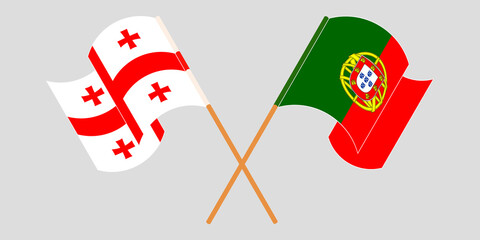 Crossed and waving flags of Georgia and Portugal