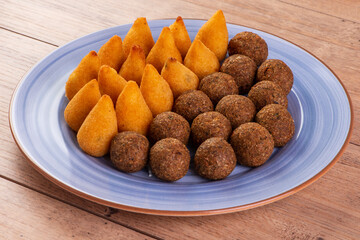 Brazilian fried savory snack mix with coxinha and fried kibbeh