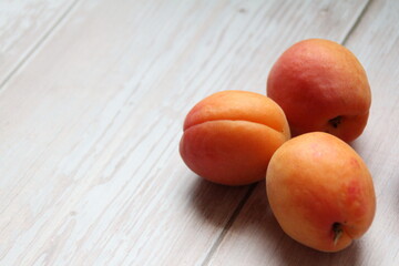 peaches on wooden table