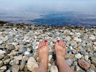 feet on the stone beach